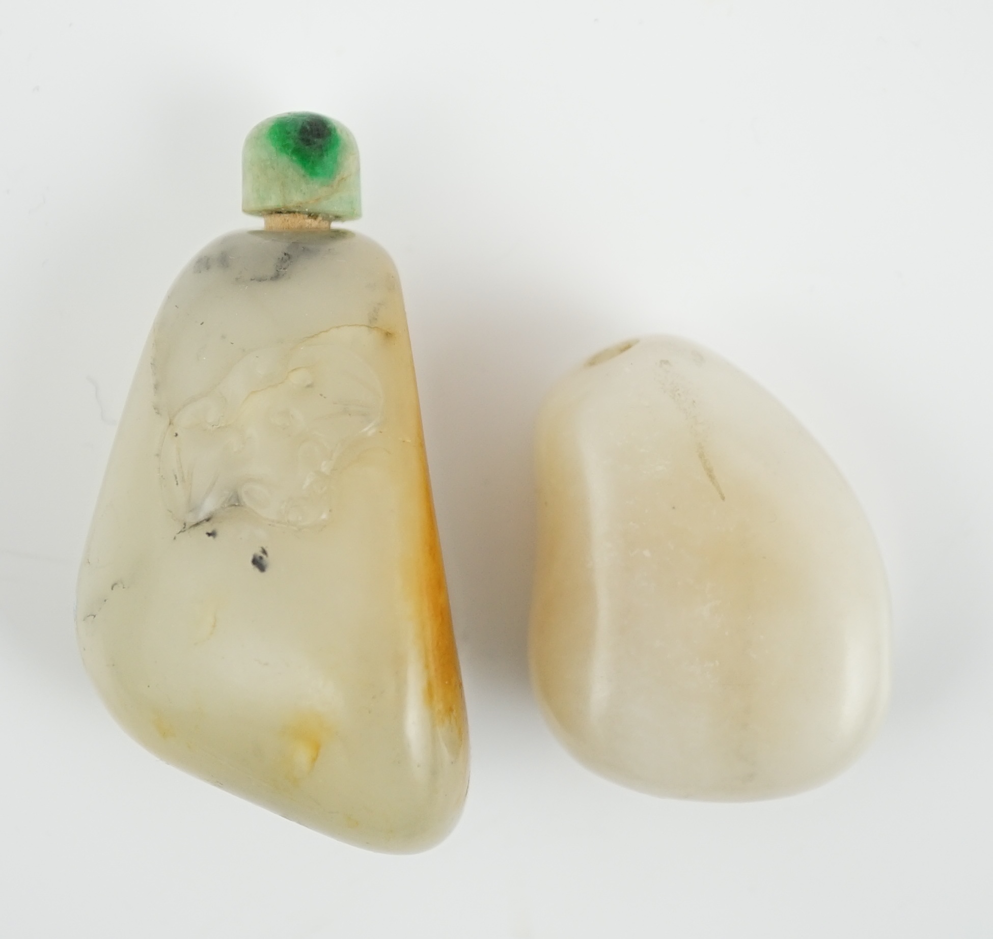 Two Chinese jade pebble snuff bottles, 19th century